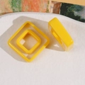 Detailed macro view of yellow nested square resin charms for DIY hair accessories - Square / Yellow