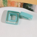 Detail of square hollow resin rings in mint green with polished finish and smooth edges - Square / Lake Green