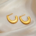 Golden C-shaped stud earrings with honeycomb texture on elegant satin fabric - Honeycomb C-Shape Studs 0175