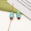 Close-up of handmade blue mushroom glass beads with colorful dots for DIY jewelry - Sky Blue
