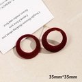Detail view of 35mm wine red flocked velvet hoop earrings with golden metal findings - Medium Round (Size 4, 1 Piece)