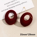Close-up of burgundy flocked hollow round earrings with gold metal bar details - Large Oval (14# - 1 Piece)