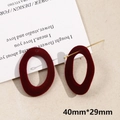 Detailed view of dark red flocked oval earrings with gold studs and size of 40x29mm - Irregular Oval (15#)