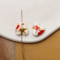 Macro shot of heart-shaped ceramic bead with hand-painted floral pattern and center hole - Red Floral Painted Style (Pattern 26) / 1 Piece