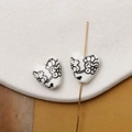 Macro detail of heart-shaped ceramic beads with hand-painted floral pattern for DIY jewelry - Black Line-Drawn Floral Style (Pattern 19) / 1 Piece