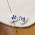 Detailed view of heart-shaped ceramic beads with blue floral patterns on a stone background - Blue & White Floral Style (Pattern 15) / 1 Piece