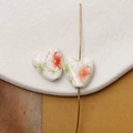 Macro detail of heart-shaped ceramic beads with hand-painted floral motifs for DIY jewelry - Red & Purple Floral with Green Leaves Style (Pattern 8) / 1 Piece