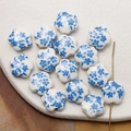 Macro detail of plum blossom ceramic beads with blue flower patterns for jewelry making - Blue (14#)