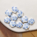 Macro shot of 10 ceramic blue and white five-petal flower beads with metal threading wire - Light Blue (11#)