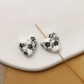 Macro shot of heart-shaped ceramic beads with hand-painted floral patterns and golden needle - Black Hand-Drawn Floral Style (Pattern 1) / 1 Piece
