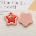 Detailed macro view of colorful resin star pendants for DIY jewelry and phone case making - Light Pink And Orange