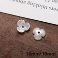 Macro shot of 10mm pearlescent white flower acrylic charms with petal textures for DIY - Medium 3-Petal Flower Shape (8#)