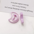 Macro shot of light purple crescent moon resin charms for DIY jewelry making and earrings - Purple Crescent Moon