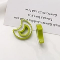 Detail of bright green resin crescent moon charms for DIY earrings on white background - Fruit Green Crescent Moon