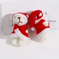 Detail of Christmas white plush bears in red outfits and hats for holiday DIY craft - Christmas Bear