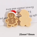 Detail of gingerbread man resin patch showing front face and flat back design, 25mm size - Gingerbread Man