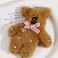 Detail of plush brown bear pendant with pink velvet bow and silver star sequins - Pink Bow Tie