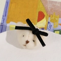 Detail view of a plush white bear hair clip featuring a soft texture and black velvet bow - Black Bow Bear Head