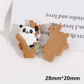 Detailed macro view of resin panda charm showing front and flat back for DIY crafts - Panda Climbing Tree