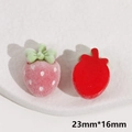 Detail view of 23mm strawberry resin patch with pink flocking and green bow knot - Flocked Strawberry