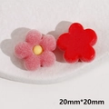 Macro detail of 20mm flocked resin flower charms in red and pink for DIY jewelry making - Flocked Flowers