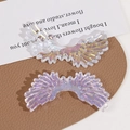 Detailed view of iridescent aurora wing charms with clear feather textures for DIY jewelry - Transparent Colorful