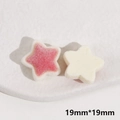Close-up of 19mm flocked star charms in pink and cream for DIY jewelry accessories - Flocking Star