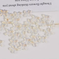 Macro view of gradient rainbow glass flower beads for DIY jewelry and hair accessories - 1 Piece / Iridescent Transparent