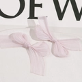 Detailed macro view of two pink organza handmade bow hair clips with sheer woven texture - Light Pink