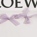 Detail of light purple mesh bow accessories displayed on a white ceramic plate - Light Purple