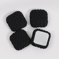 Detailed view of four black square woven texture DIY charms with smooth metal backings - Black