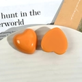 Pair of glossy orange resin heart charms for DIY jewelry and hair accessories - Heart Shaped / Orange