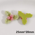Detailed view of pink flocked holly berries and green leaves for DIY Christmas crafts - Holly Berries Style