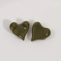 Detail view of glossy olive green resin heart charms for DIY jewelry accessories - Green