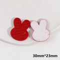 Macro view of 30x23mm red rabbit acrylic charm with sparkly rhinestones for DIY crafts - Rabbit Head