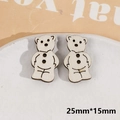 Detail van lasergesneden houten beerknoppen 25x15mm voor DIY-sieraden en ambachten - Witte Beer
