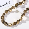 Macro detail of irregular gold-tone faceted glass beads for DIY jewelry making accessories - Irregular Faceted Style (1#) / 1 Piece / Gold