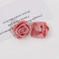 Macro detail of handmade light pink ribbon rose flower for DIY crafts and hair accessories - Light Pink