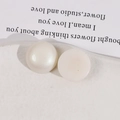 Macro view of 18mm matte pearl acrylic flatback beads for DIY jewelry and accessories - White