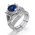 Elegante dubbellaagse zilveren ringenset met grote blauwe steen en witte zirkonen - US 7 / Wit Goud Blauwe Zirkonia