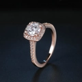 Elegant rose gold wedding ring featuring a round zircon center stone and halo setting - US 5 / Rose Gold
