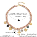 Detail view of pink woven cord necklace with sun, heart, and cross stainless steel charms - Pink Rope Sun Heart Style (JDN2501201-1)