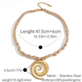 Detailed macro view of large 4.5cm gold spiral pendant and colorful woven cord necklace - Pink Green Rope Large Spiral Pendant Style (JDN2501202)