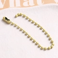 Detail of yellow matte finish metal ball bead chain with connector for DIY accessory - Beige