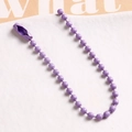 Macro view of purple matte finish iron bead chain with matching connector clasp for DIY crafts - Purple