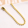 Detail of a bright yellow lacquered ball chain with a secure connector clasp - Bright Yellow