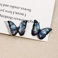 Detailed macro view of resin butterfly charms with blue-purple gradient and gold leaf flakes - 4# Small Dark Blue Gradient (B70-3-9-13)