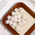 Detail of DIY cat paw beads with white flocking texture and pink pads on a tray - Cat Paw Shape / 1 Piece / Rose Red