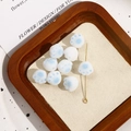 Macro detail of cute flocked cat paw charms in white and light blue for jewelry making - Cat Paw Shape / 1 Piece / Blue