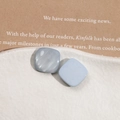 Macro detail of square resin earrings featuring mother of pearl and matte blue finish - Light Blue Rectangular
